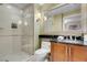 Elegant bathroom with a glass shower and granite vanity at 135 E Harmon Ave # 2501, Las Vegas, NV 89109