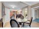 Small dining area with glass table and chairs, adjacent to the kitchen at 135 E Harmon Ave # 2501, Las Vegas, NV 89109