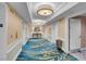 Elegant hallway with blue patterned carpet and modern lighting at 135 E Harmon Ave # 2501, Las Vegas, NV 89109