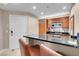 Modern kitchen with wood cabinets and breakfast bar at 135 E Harmon Ave # 2501, Las Vegas, NV 89109