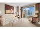 Elegant living room boasts a neutral color scheme and stunning city views at 135 E Harmon Ave # 2501, Las Vegas, NV 89109