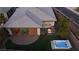 Aerial view of house and backyard, showcasing landscaping and hot tub at 138 Reflection Cove Dr, Henderson, NV 89011