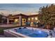 This home boasts a stunning backyard with a hot tub and patio area at 138 Reflection Cove Dr, Henderson, NV 89011