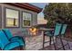 Relaxing backyard oasis with fire pit and seating at 138 Reflection Cove Dr, Henderson, NV 89011