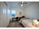 Cozy bedroom with a ceiling fan, neutral tones, a desk, and a comfortable bed at 138 Reflection Cove Dr, Henderson, NV 89011