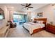 Spacious main bedroom with backyard access and king-size bed at 138 Reflection Cove Dr, Henderson, NV 89011