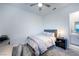 Serene bedroom with a ceiling fan, neutral tones, a desk, and a comfortable bed at 138 Reflection Cove Dr, Henderson, NV 89011