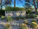 The 'Reflection Bay Golf and Beach Club' community sign is surrounded by desert landscaping at 138 Reflection Cove Dr, Henderson, NV 89011