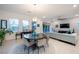 Elegant dining room with a large round table and modern chairs at 138 Reflection Cove Dr, Henderson, NV 89011