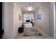 Bright entryway with a bench and rug, leading to the living area at 138 Reflection Cove Dr, Henderson, NV 89011