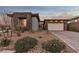 Modern home with stone accents and a two car garage at 138 Reflection Cove Dr, Henderson, NV 89011