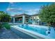 Hot tub with a gray coping and surrounded by landscaping at 138 Reflection Cove Dr, Henderson, NV 89011