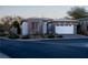 Single-story house with a two-car garage and desert landscaping at 138 Reflection Cove Dr, Henderson, NV 89011