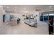 Open concept kitchen with island, stainless steel appliances, and blue tile backsplash at 138 Reflection Cove Dr, Henderson, NV 89011