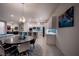 Open-concept kitchen with white cabinets, a large island, and modern stainless steel appliances at 138 Reflection Cove Dr, Henderson, NV 89011