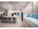 Modern kitchen with white cabinets, quartz countertops, and stainless steel appliances at 138 Reflection Cove Dr, Henderson, NV 89011