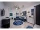 Relaxing living room featuring a sectional sofa and a kitchenette at 138 Reflection Cove Dr, Henderson, NV 89011