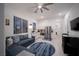 Open-concept living area featuring modern furniture, a kitchen area, and bright natural light at 138 Reflection Cove Dr, Henderson, NV 89011