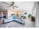 Bright, open-concept living room with modern furniture and a seamless flow to the kitchen at 138 Reflection Cove Dr, Henderson, NV 89011