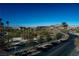 Curving road with palm trees and lake views at 138 Reflection Cove Dr, Henderson, NV 89011