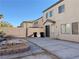 Backyard with patio, fire pit, and trash cans at 1404 Crystal Rainey Ave, North Las Vegas, NV 89086