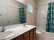 Clean bathroom with double sinks, tub, and shower at 1404 Crystal Rainey Ave, North Las Vegas, NV 89086