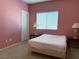 Bedroom with pink walls and a double bed at 1404 Crystal Rainey Ave, North Las Vegas, NV 89086