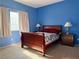 Cozy bedroom with a blue accent wall and double bed at 1404 Crystal Rainey Ave, North Las Vegas, NV 89086