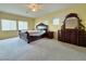 Main bedroom with large bed and ornate furniture at 1404 Crystal Rainey Ave, North Las Vegas, NV 89086