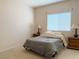 Simple bedroom with neutral colors and natural light at 1404 Crystal Rainey Ave, North Las Vegas, NV 89086