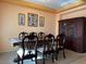 Formal dining room with wood table and chairs, and a hutch at 1404 Crystal Rainey Ave, North Las Vegas, NV 89086