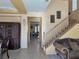 Bright entryway with tile floors, staircase, and views to other rooms at 1404 Crystal Rainey Ave, North Las Vegas, NV 89086