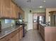 Bright kitchen with ample cabinetry and granite countertops at 1404 Crystal Rainey Ave, North Las Vegas, NV 89086