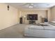 Bright living room with large sectional sofa and flat-screen TV at 1404 Crystal Rainey Ave, North Las Vegas, NV 89086