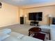 Bright living room with large sectional sofa and flat-screen TV at 1404 Crystal Rainey Ave, North Las Vegas, NV 89086