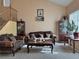 Living room with hardwood floors, comfortable seating, and a staircase at 1404 Crystal Rainey Ave, North Las Vegas, NV 89086