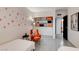 Bedroom with orange accents and built-in shelving, near bathroom at 1558 Aztec Way, Las Vegas, NV 89169