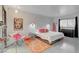 Primary bedroom with a pop of pink and a snake-print rug at 1558 Aztec Way, Las Vegas, NV 89169