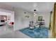 Bright dining room with a glass table and mid-century modern decor at 1558 Aztec Way, Las Vegas, NV 89169