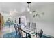 Mid-century modern dining room with glass table and metal chairs at 1558 Aztec Way, Las Vegas, NV 89169