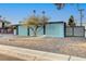 Midcentury modern home with a unique blue block wall facade at 1558 Aztec Way, Las Vegas, NV 89169