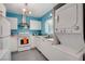 Clean and efficient kitchen with white appliances and blue accents at 1558 Aztec Way, Las Vegas, NV 89169