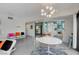 Modern white kitchen with stainless steel appliances and a breakfast bar at 1558 Aztec Way, Las Vegas, NV 89169