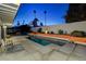 Inviting backyard oasis with a sparkling pool and patio area at 1558 Aztec Way, Las Vegas, NV 89169