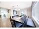 Dining room features a large wood table with gray cushioned chairs and bench at 1574 Teardrop St, Las Vegas, NV 89142