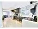 Modern kitchen with dark cabinets, white subway tile backsplash, and stainless steel appliances at 1574 Teardrop St, Las Vegas, NV 89142