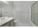 Clean bathroom with gray vanity, large mirror, and shower/tub combo at 1900 High Valley Ct # 104, Las Vegas, NV 89128