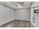 Well-lit dining area with wood-look floors and a window with blinds at 1900 High Valley Ct # 104, Las Vegas, NV 89128