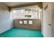 Private patio with green flooring and building view at 1900 High Valley Ct # 104, Las Vegas, NV 89128