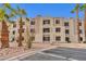 Two-story building exterior with parking and desert landscaping at 2072 Mesquite Ln # 104, Laughlin, NV 89029